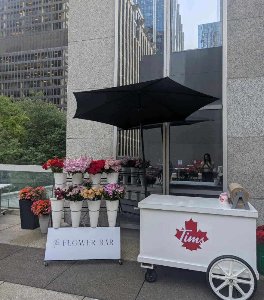 A custom flower cart, branded for Tim Hortons, and hosted by May Flowers